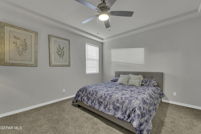 bedroom featuring ceiling fan and carpet