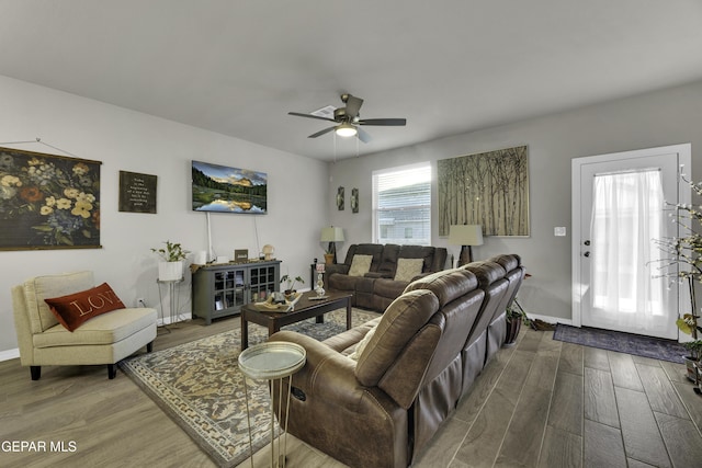 living room with ceiling fan and hardwood / wood-style floors