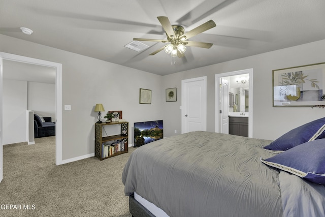 carpeted bedroom with connected bathroom and ceiling fan