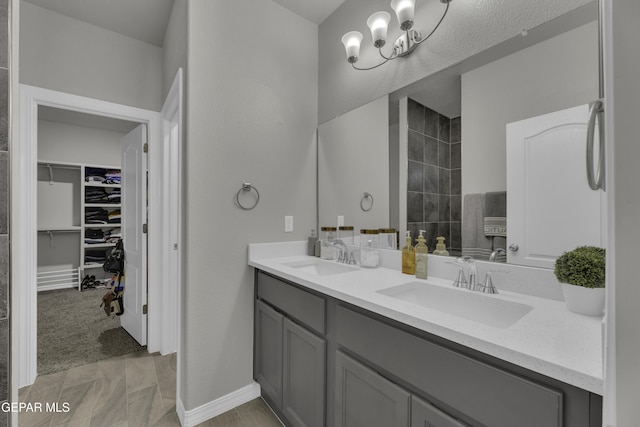 bathroom with vanity and a shower