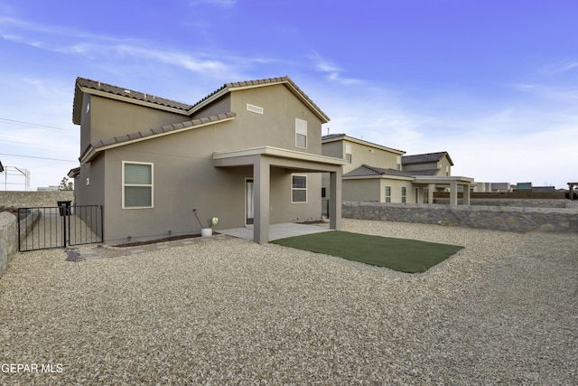 rear view of house with a patio area