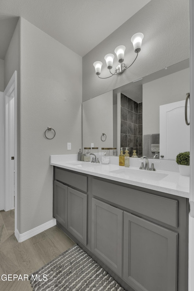 bathroom with vanity and a textured ceiling