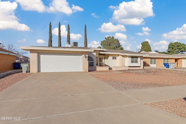 ranch-style house featuring a garage