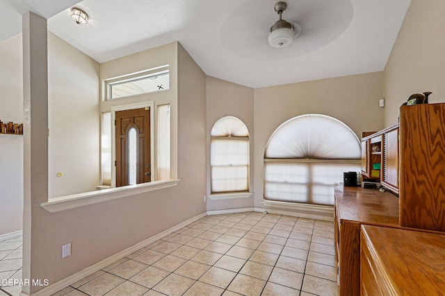 interior space with vaulted ceiling and ceiling fan