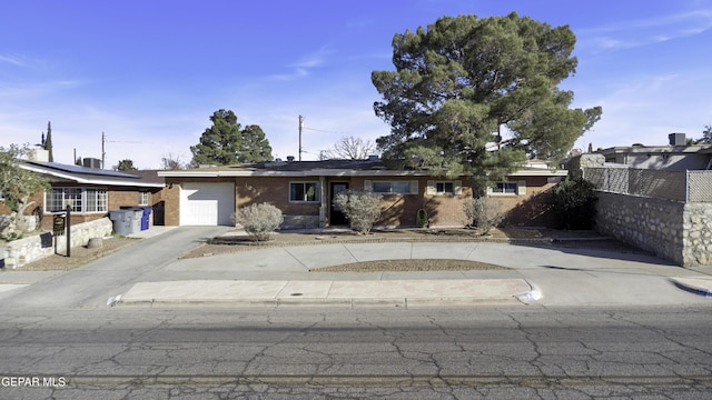 single story home featuring a garage