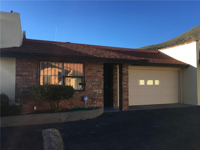 single story home featuring a garage