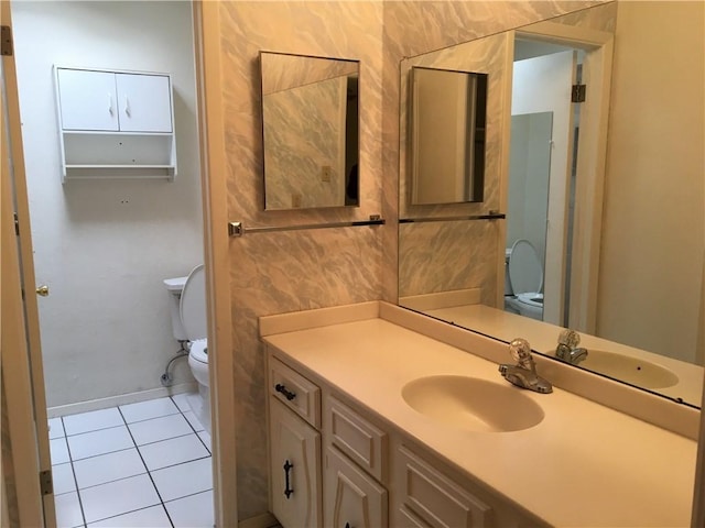 bathroom with tile patterned floors, toilet, and vanity