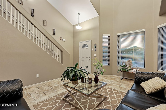 foyer entrance with high vaulted ceiling