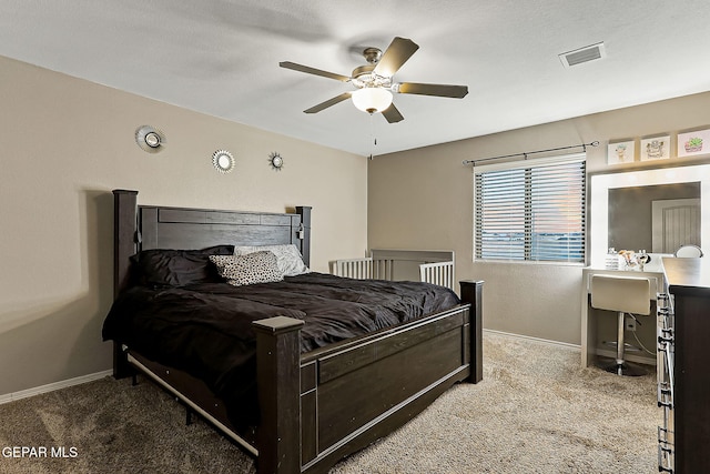 bedroom featuring ceiling fan and carpet