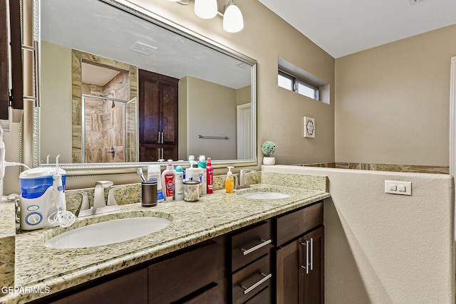 bathroom featuring vanity and a tile shower