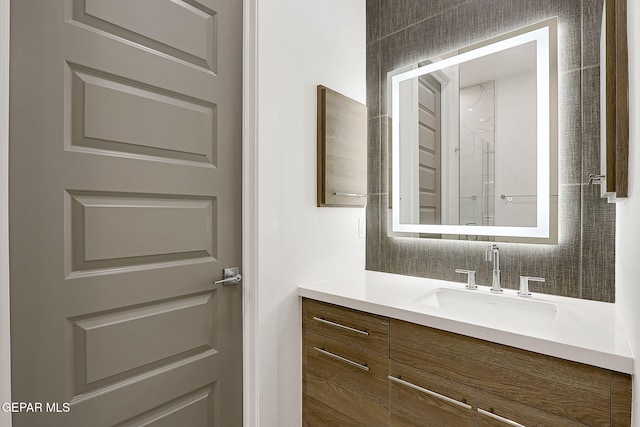 bathroom featuring vanity and a shower