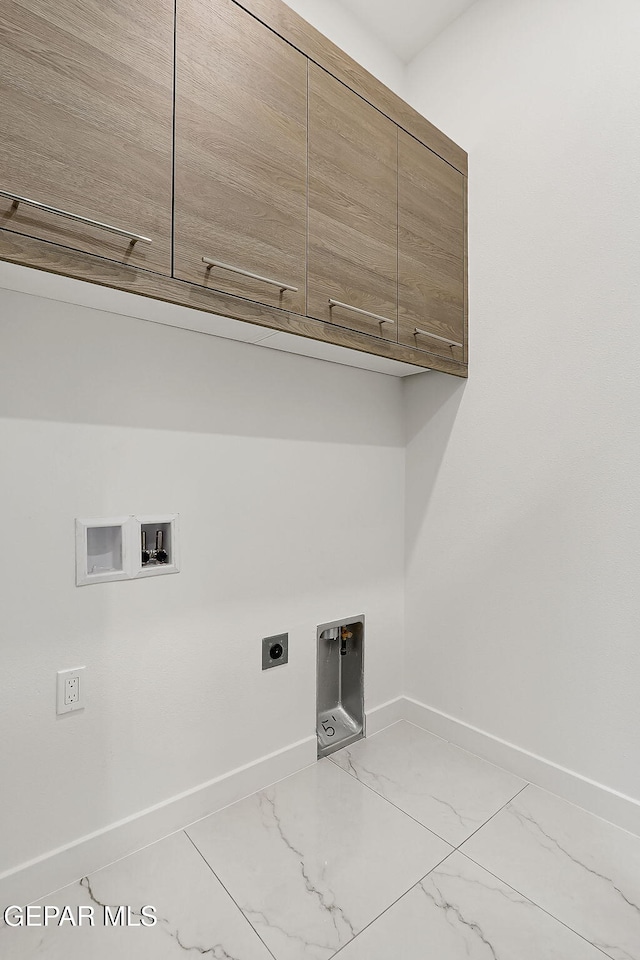 laundry area featuring cabinets, hookup for a washing machine, and electric dryer hookup