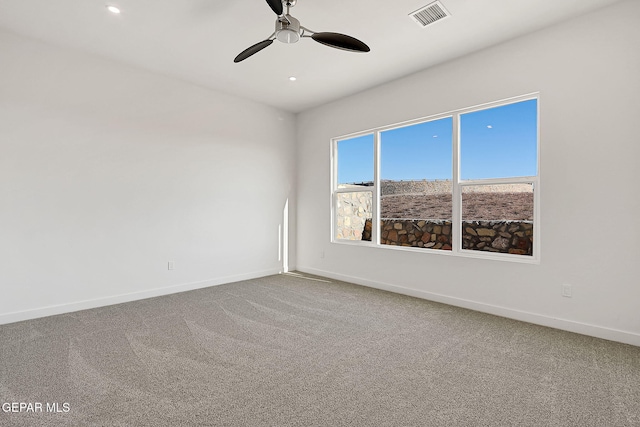 empty room with carpet and ceiling fan