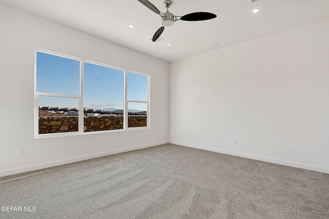 unfurnished room with carpet floors and ceiling fan