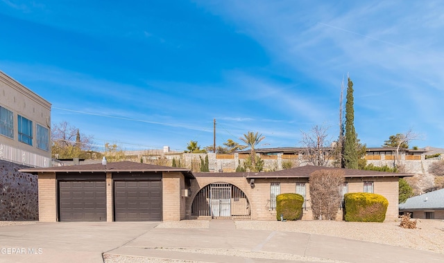 ranch-style home with a garage