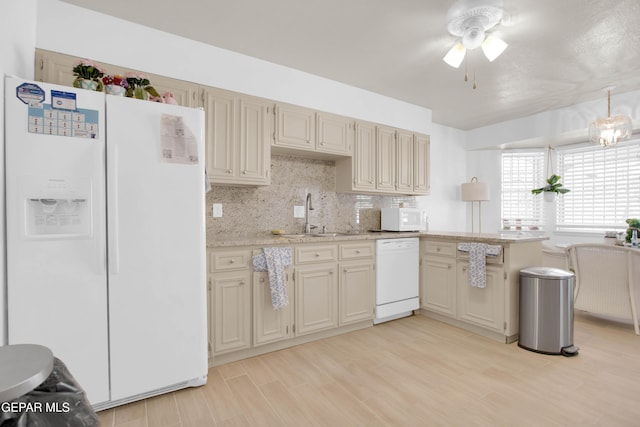 kitchen featuring sink, cream cabinetry, white appliances, light hardwood / wood-style floors, and backsplash