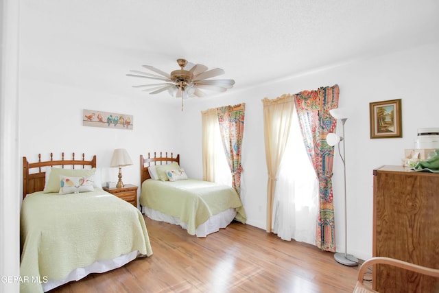 bedroom featuring hardwood / wood-style flooring and ceiling fan