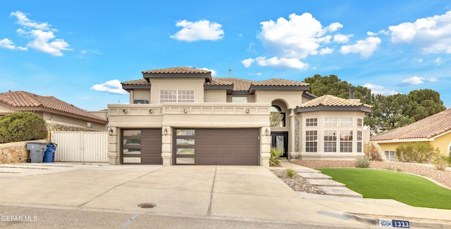 mediterranean / spanish house featuring a garage