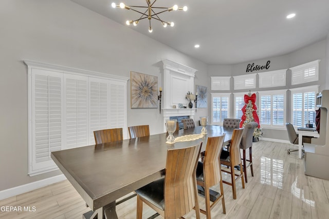 dining room featuring light hardwood / wood-style flooring and a notable chandelier