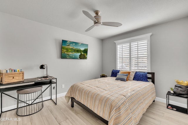 bedroom with ceiling fan and light hardwood / wood-style flooring