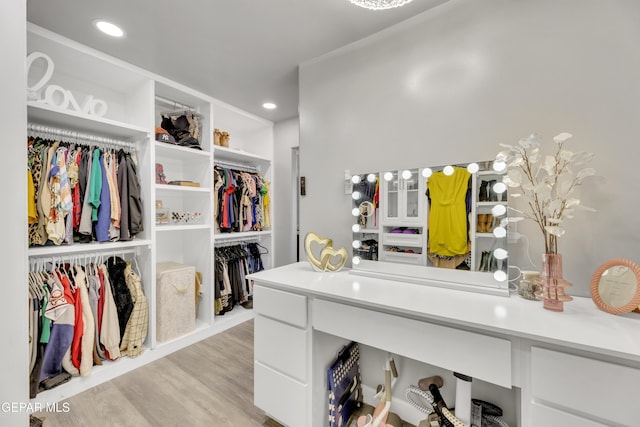 spacious closet with light hardwood / wood-style floors