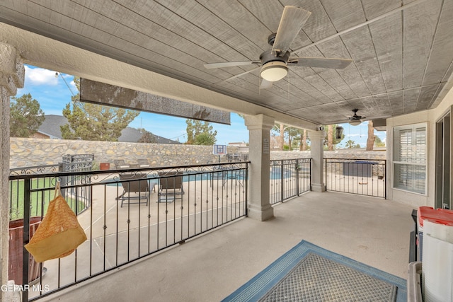 view of patio / terrace featuring a community pool and ceiling fan