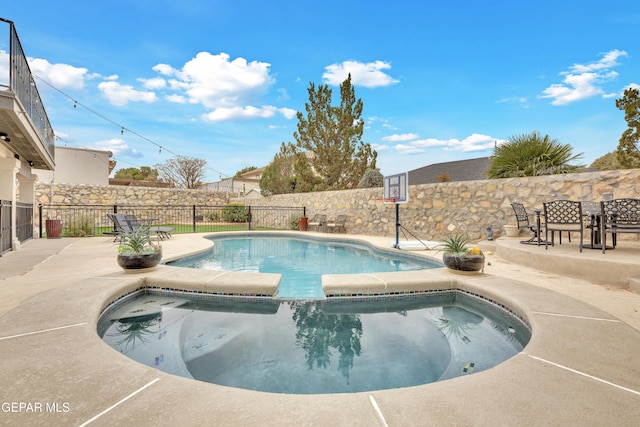 view of swimming pool featuring a patio area