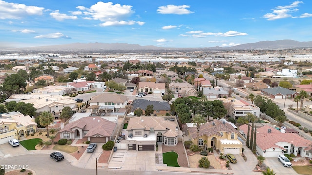 birds eye view of property with a mountain view