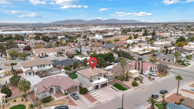 birds eye view of property with a mountain view