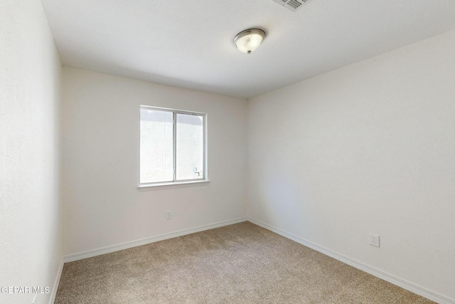 empty room with carpet flooring