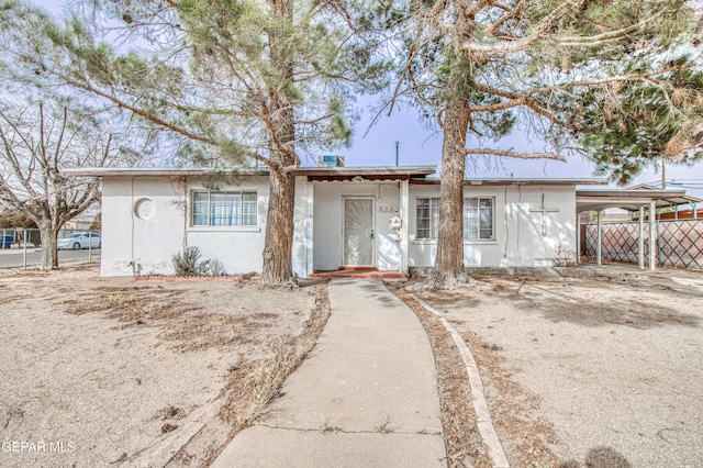 single story home with a carport