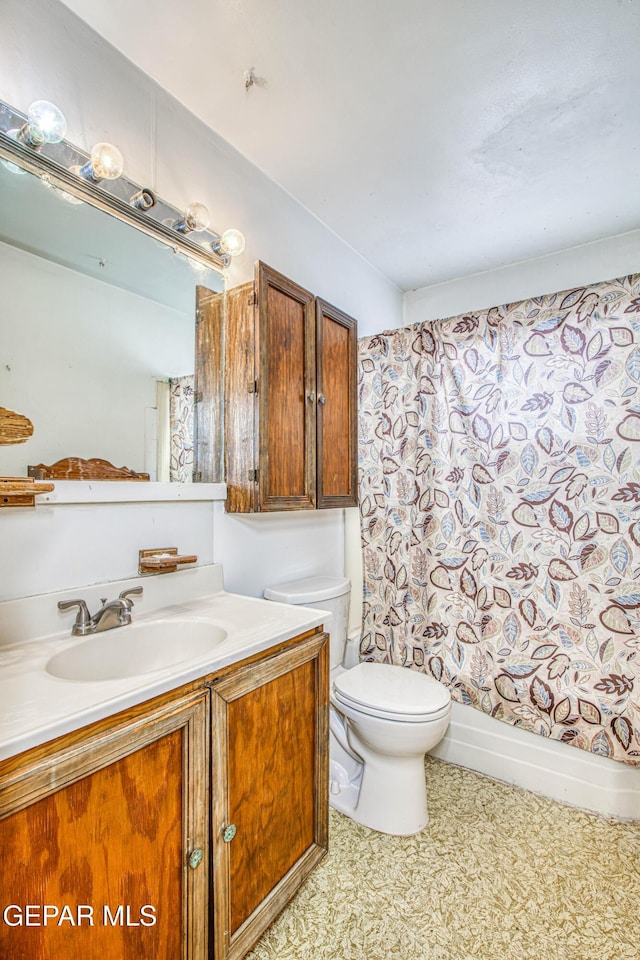 full bathroom with vanity, toilet, and shower / tub combo