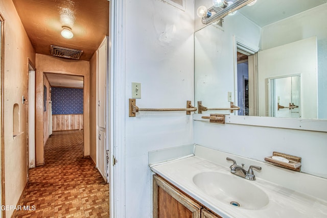 bathroom featuring vanity and parquet floors