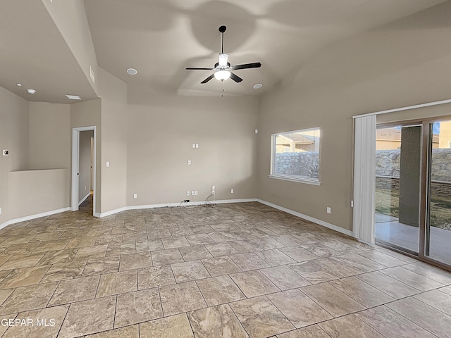 spare room with ceiling fan and lofted ceiling