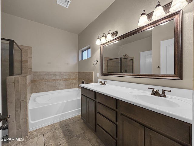 bathroom with independent shower and bath, vanity, and tile patterned floors