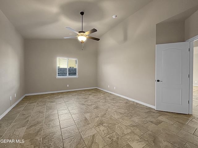 empty room with lofted ceiling and ceiling fan