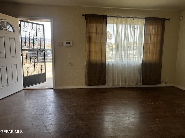 entrance foyer with dark hardwood / wood-style floors