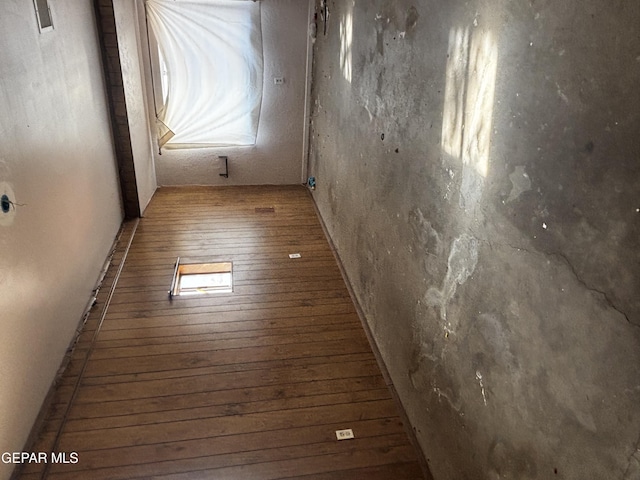 empty room with wood-type flooring