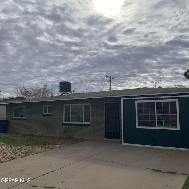 single story home featuring cooling unit