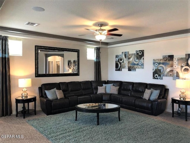 carpeted living room featuring visible vents and a ceiling fan