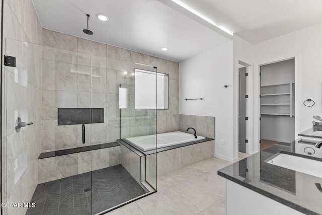 bathroom featuring sink and plus walk in shower