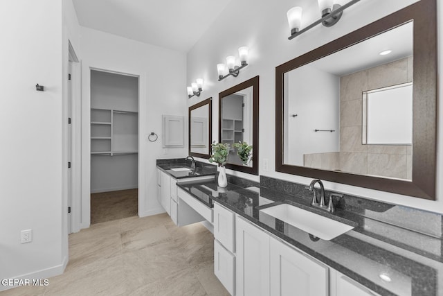 bathroom featuring vanity and a notable chandelier