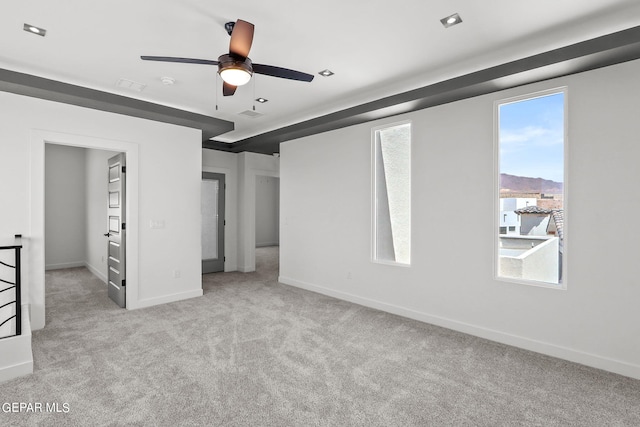 unfurnished bedroom with ceiling fan and light carpet