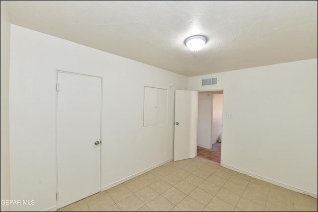 unfurnished bedroom featuring a textured ceiling