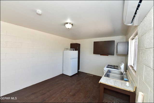 kitchen with sink, dark hardwood / wood-style floors, and white refrigerator