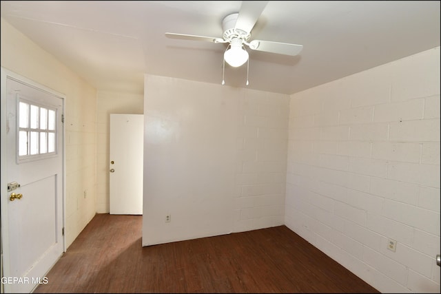 unfurnished room featuring ceiling fan and dark hardwood / wood-style floors