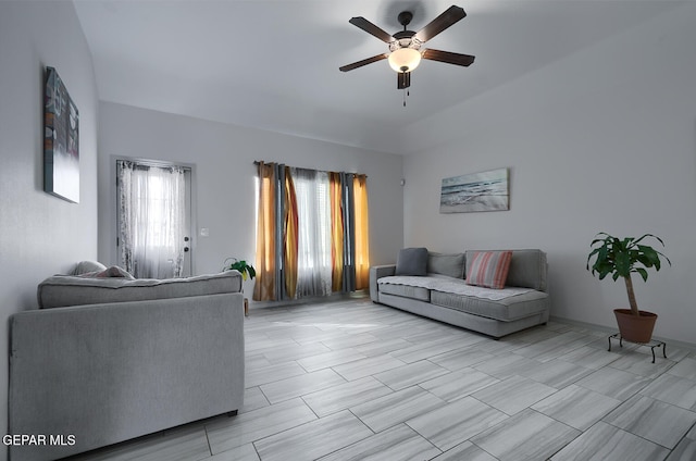 living room featuring ceiling fan and plenty of natural light