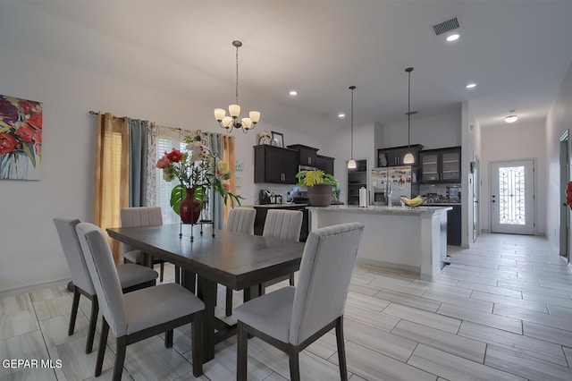 dining space featuring a chandelier