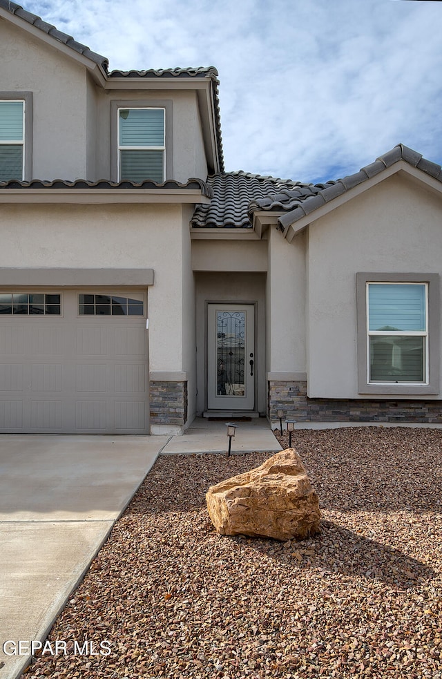 property entrance featuring a garage