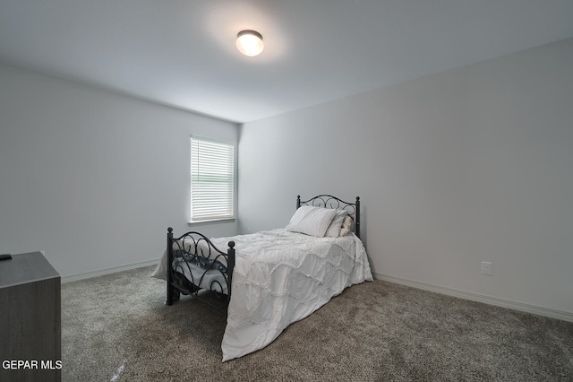 bedroom featuring dark colored carpet